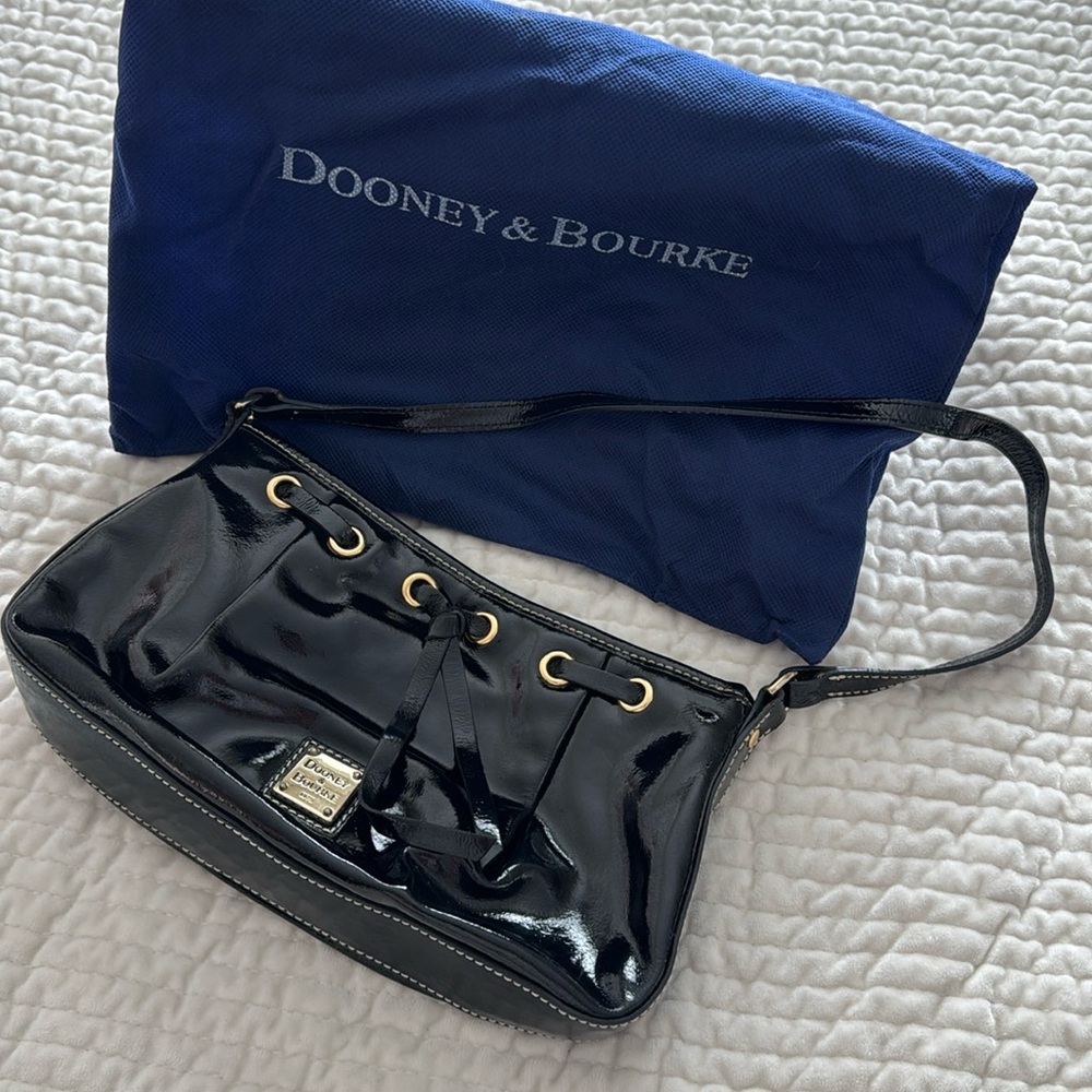 Patent leather shoulder bag with gold hardware